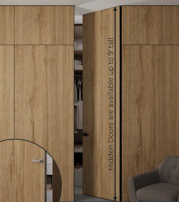Floor-to-ceiling hidden interior door in an oak decorative panel, set flush with the wall